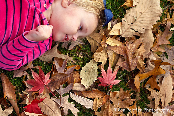 Girl Playing in the Leaves